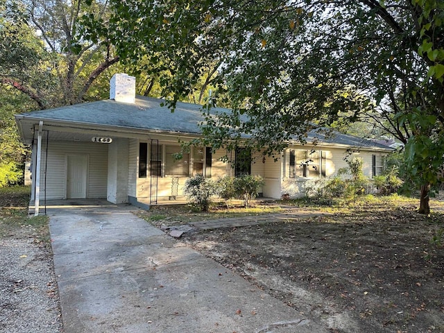 view of front of home with a carport