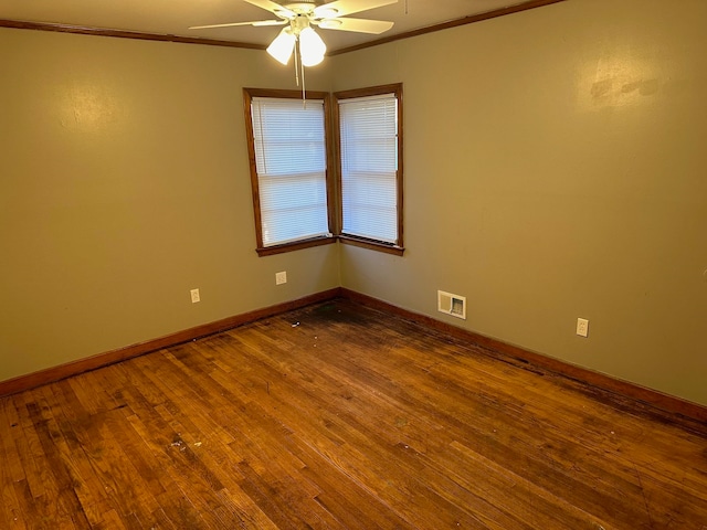 unfurnished room with crown molding, wood-type flooring, and ceiling fan