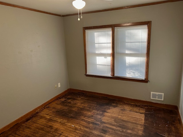 unfurnished room with ornamental molding, ceiling fan, and dark hardwood / wood-style flooring