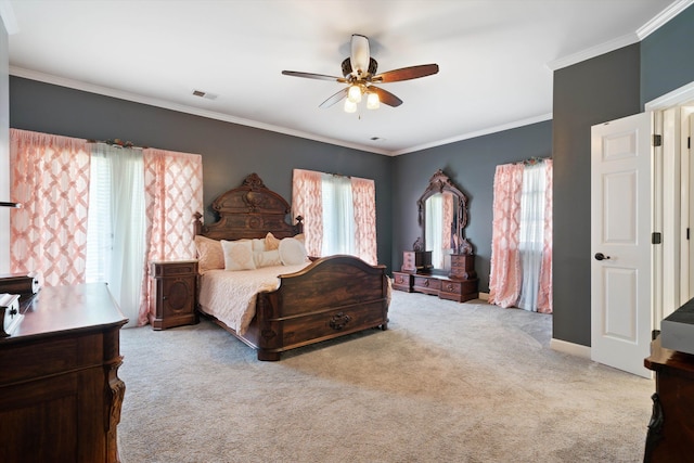 bedroom featuring light carpet, crown molding, and ceiling fan