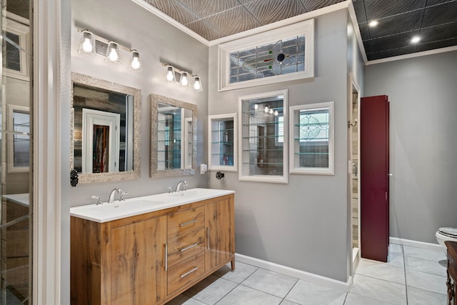 bathroom featuring vanity, ornamental molding, and tile patterned flooring