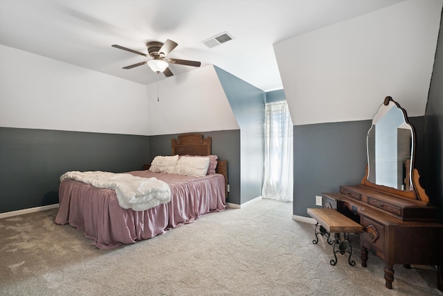 bedroom featuring ceiling fan, light carpet, and vaulted ceiling