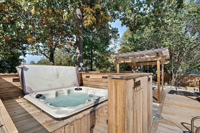 wooden terrace featuring a covered hot tub