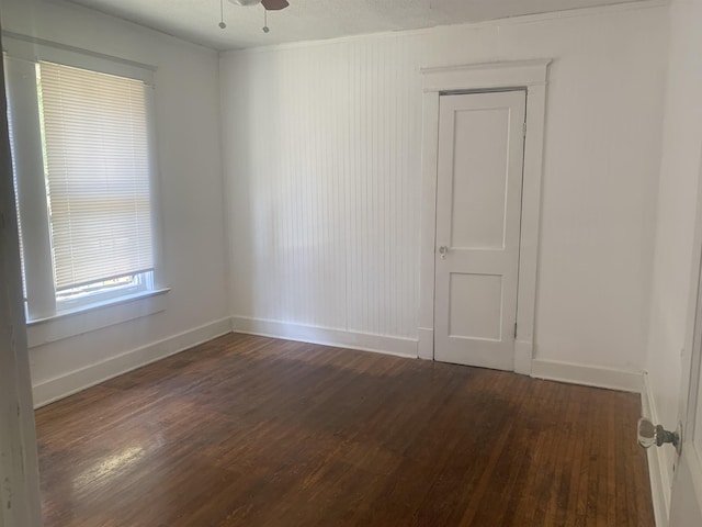 1616 Kendale Ave, Memphis, TN 38106 - unfurnished room with dark wood-style flooring, a ceiling fan, and baseboards