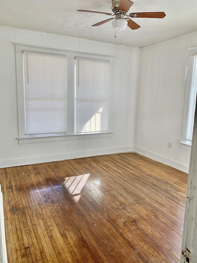 1616 Kendale Ave, Memphis, TN 38106 - spare room featuring a wealth of natural light, ceiling fan, hardwood / wood-style floors, and baseboards