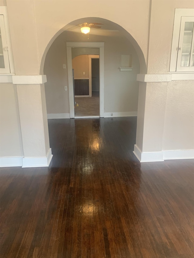 1616 Kendale Ave, Memphis, TN 38106 - empty room with arched walkways, hardwood / wood-style floors, a ceiling fan, and baseboards