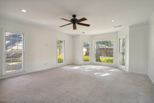 unfurnished room featuring ceiling fan, ornamental molding, and light colored carpet