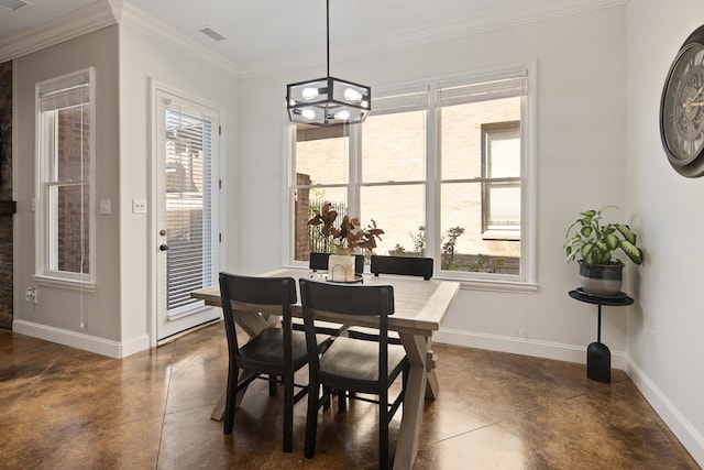 dining space with crown molding