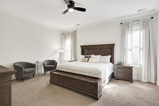 carpeted bedroom featuring ceiling fan and ornamental molding