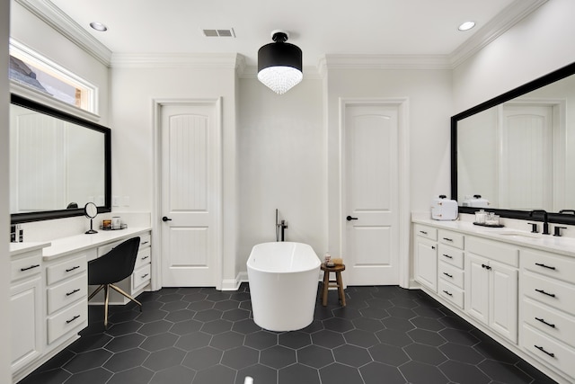 bathroom featuring a bathtub, crown molding, tile patterned floors, and vanity