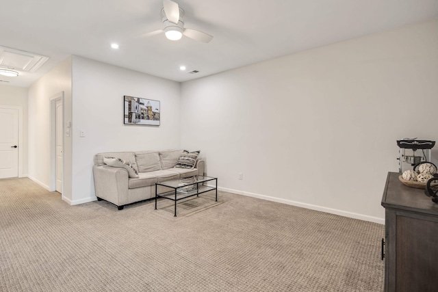 carpeted living room featuring ceiling fan