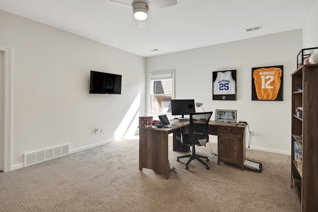 carpeted home office with ceiling fan