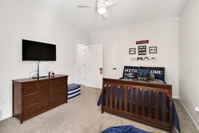 carpeted bedroom featuring crown molding and ceiling fan