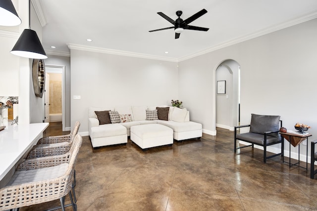 living room with crown molding and ceiling fan