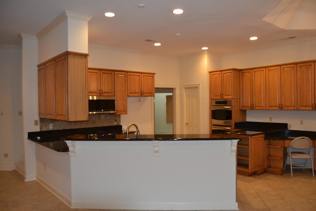 kitchen featuring kitchen peninsula, ornamental molding, sink, light tile patterned floors, and appliances with stainless steel finishes