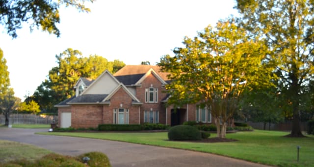 view of front of home with a front yard