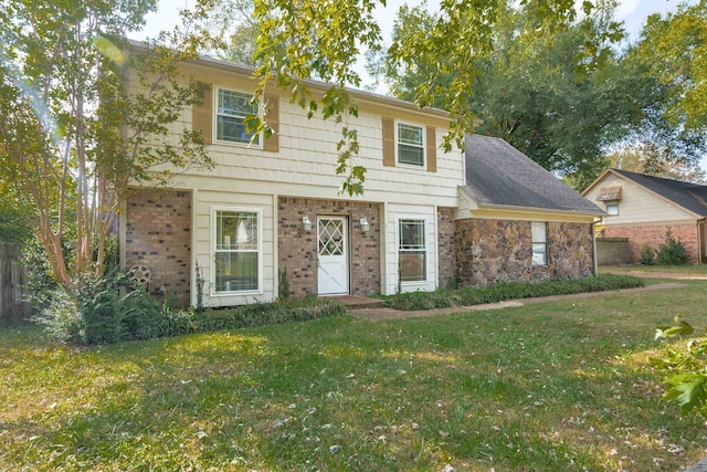 colonial inspired home featuring a front yard