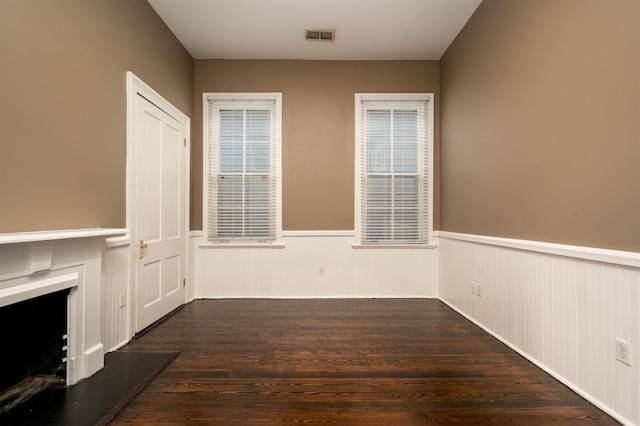 376 Mulberry St, Memphis, TN 38103 - interior space with a wainscoted wall, a fireplace with raised hearth, and wood finished floors