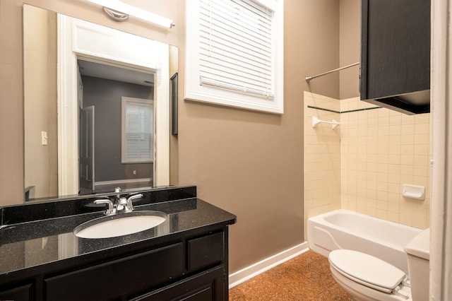 376 Mulberry St, Memphis, TN 38103 - full bathroom featuring vanity, baseboards, toilet, and shower / washtub combination