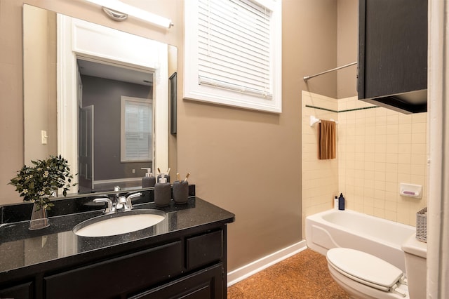 376 Mulberry St, Memphis, TN 38103 - full bathroom with toilet, baseboards, tub / shower combination, and vanity