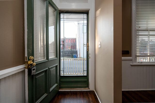 doorway with dark wood-type flooring