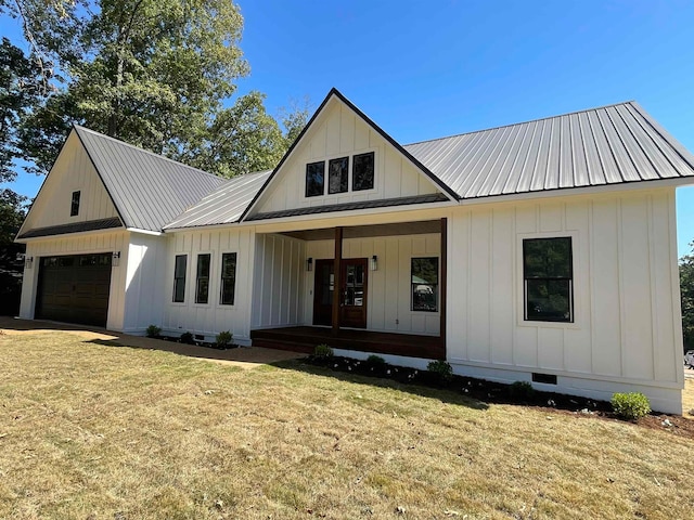 modern farmhouse with a garage, metal roof, crawl space, a porch, and board and batten siding