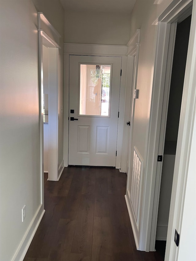 doorway to outside with dark wood-type flooring