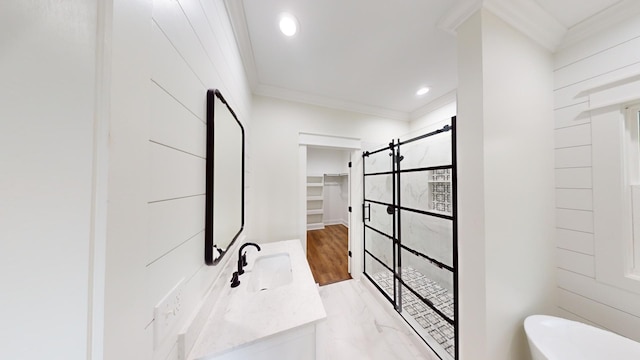 bathroom featuring hardwood / wood-style floors, vanity, an enclosed shower, and ornamental molding