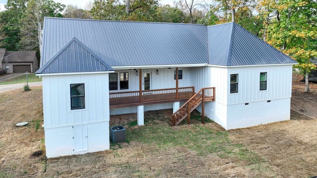 modern farmhouse style home featuring stairs, metal roof, crawl space, and cooling unit