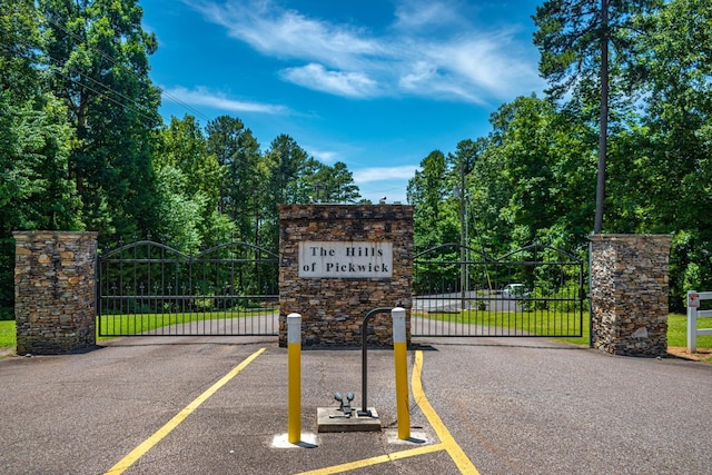 exterior space featuring a gate and a gated entry