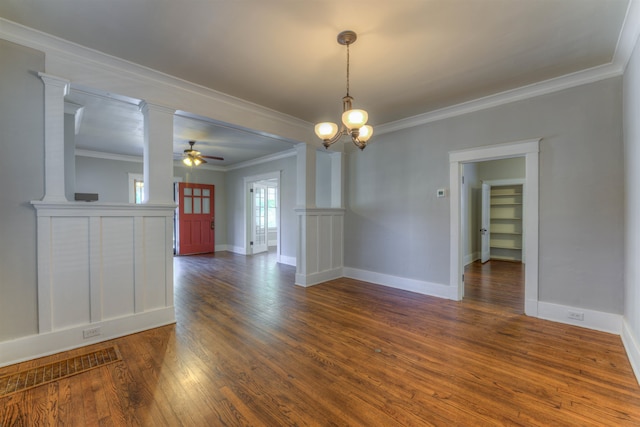 unfurnished room featuring ceiling fan with notable chandelier, crown molding, ornate columns, and dark hardwood / wood-style floors