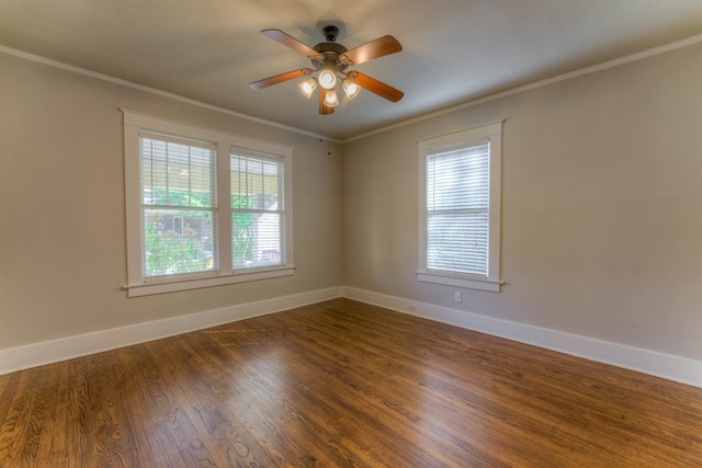 empty room with crown molding, dark hardwood / wood-style floors, and ceiling fan