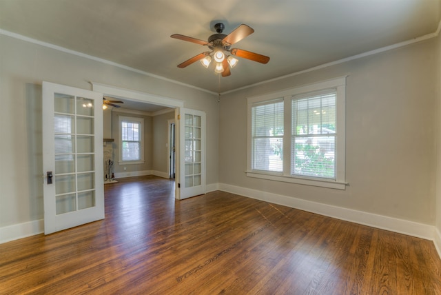 empty room with french doors, ceiling fan, and dark wood-type flooring