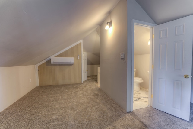 bonus room featuring lofted ceiling, a wall mounted AC, and light colored carpet