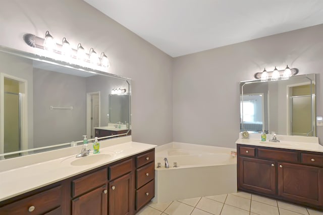 bathroom with vanity, tile patterned floors, and shower with separate bathtub