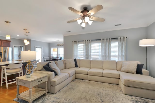 living room with light hardwood / wood-style flooring and ceiling fan