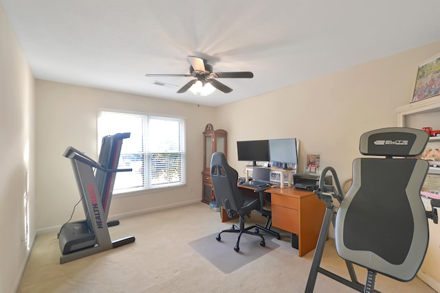 carpeted office with ceiling fan