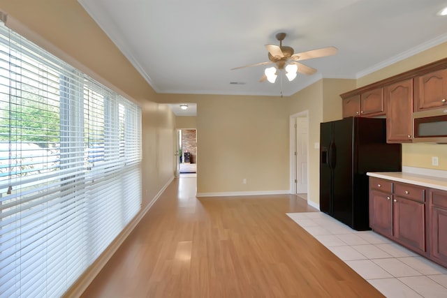 kitchen featuring black refrigerator with ice dispenser, crown molding, light wood-type flooring, and ceiling fan