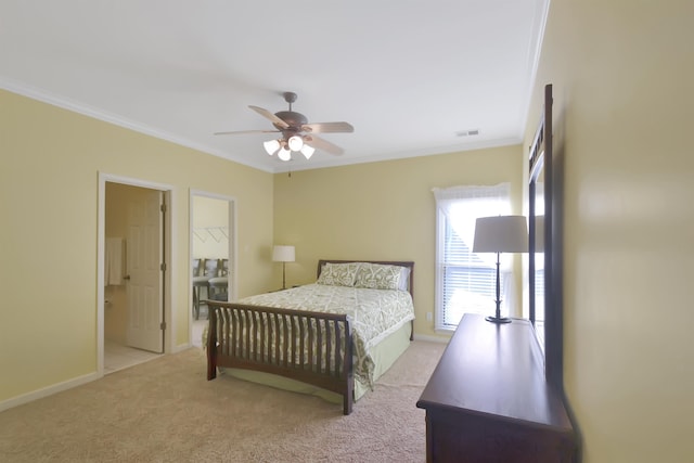 carpeted bedroom with ceiling fan, crown molding, and ensuite bath