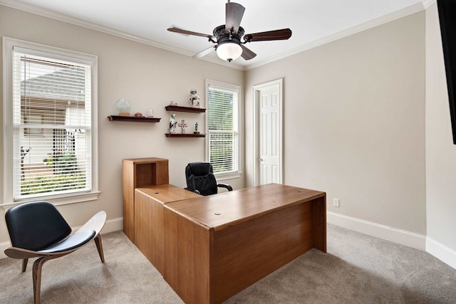 office area with ornamental molding, light colored carpet, and ceiling fan