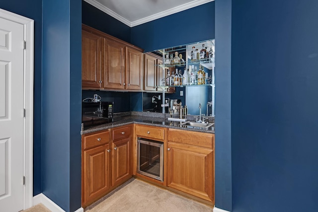 kitchen featuring light carpet, wine cooler, dark stone countertops, crown molding, and sink