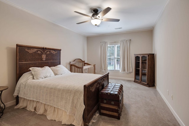 bedroom featuring ceiling fan, light carpet, and ornamental molding