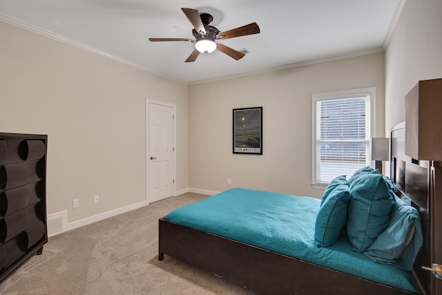 bedroom featuring crown molding, light carpet, and ceiling fan