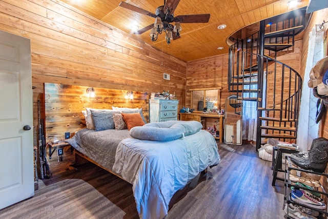 bedroom featuring wood walls, hardwood / wood-style floors, ceiling fan, and wooden ceiling