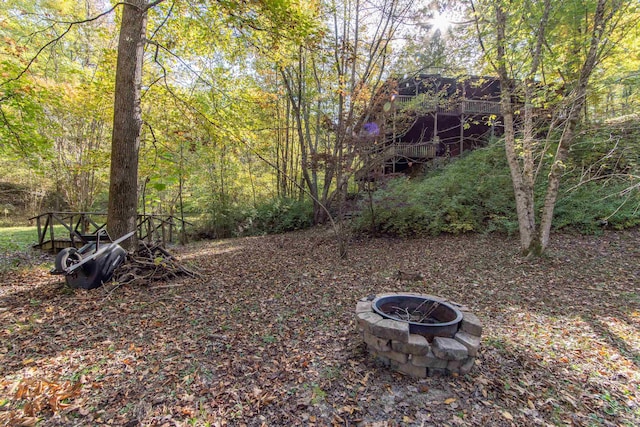 view of yard with a fire pit