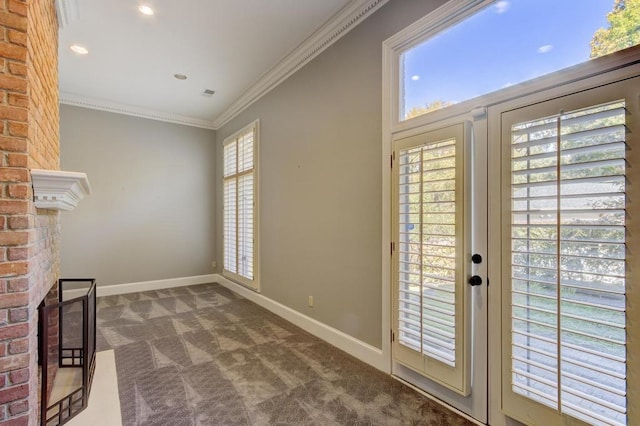 interior space with carpet flooring, ornamental molding, and a fireplace