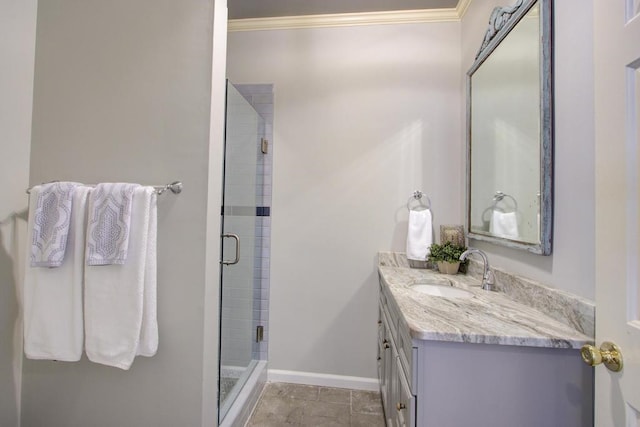 bathroom with vanity, ornamental molding, and an enclosed shower