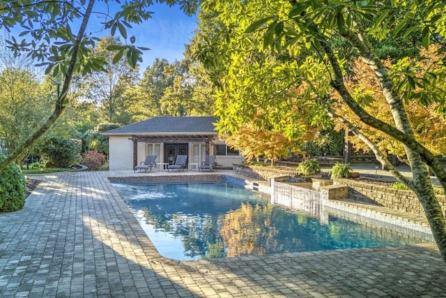 view of swimming pool with a patio area