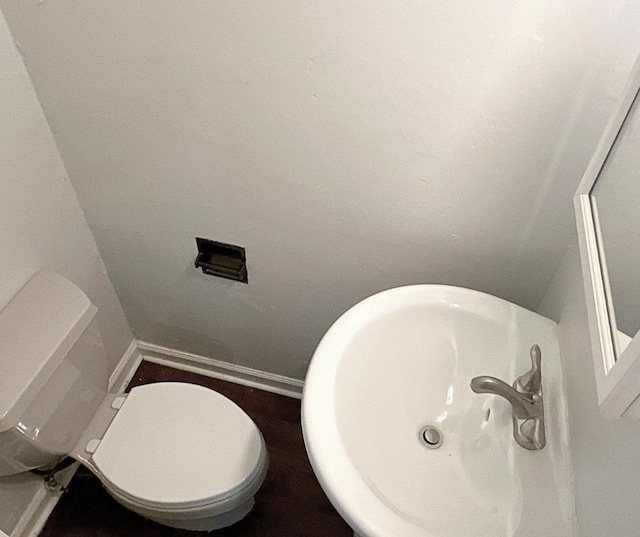 bathroom featuring sink and toilet