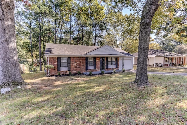 ranch-style home with covered porch, a garage, and a front lawn